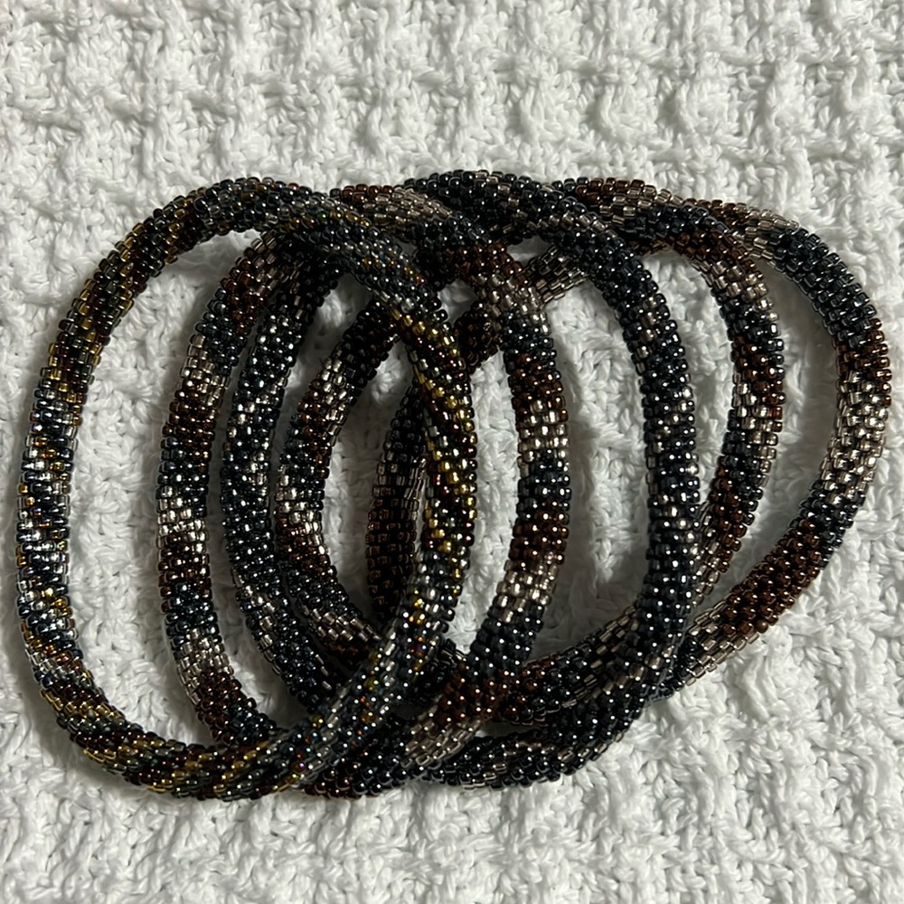 Sashka Co handcrafted glass bead bracelet lot. Dark metallics. Appr 8”. Roll on.